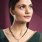 Brilliant Dazzling CZ Mangalsutra Set. Gold CZ mangalsutra set with black beads and matching earrings