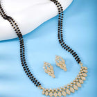 Stunning Radiant CZ Mangalsutra Set. Gold CZ mangalsutra set with black beads and matching earrings, in teardrop shape.