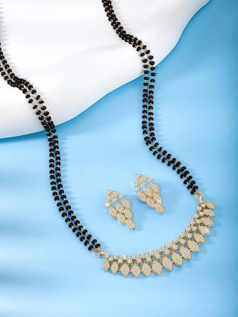 Stunning Radiant CZ Mangalsutra Set. Gold CZ mangalsutra set with black beads and matching earrings, in teardrop shape.