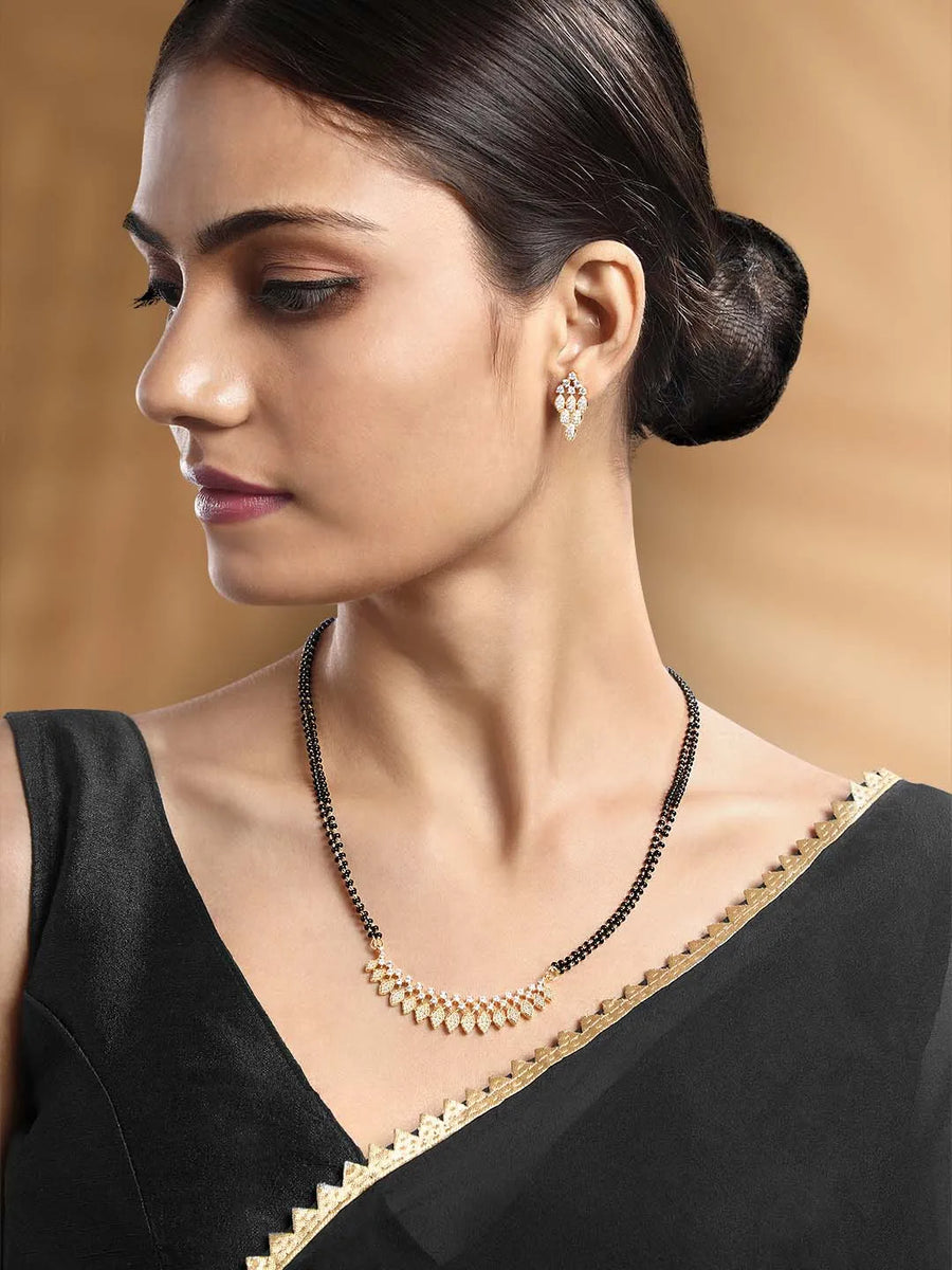 Stunning Radiant CZ Mangalsutra Set. Gold CZ mangalsutra set with black beads and matching earrings, in teardrop shape.