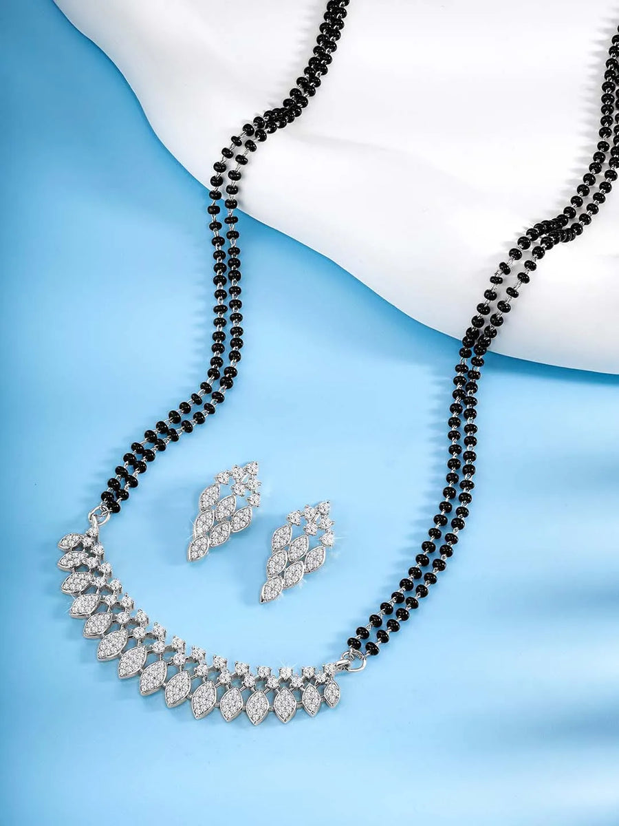 Stunning Radiant CZ Mangalsutra Set. Silver CZ mangalsutra set with black beads and matching earrings, in teardrop shape.