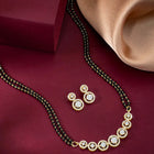 Luxurious Gleaming CZ Mangalsutra Set. Mangalsutra and matching earrings with cubic zirconia stones along with gold plating.