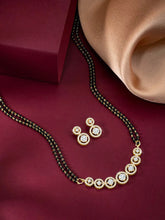 Luxurious Gleaming CZ Mangalsutra Set. Mangalsutra and matching earrings with cubic zirconia stones along with gold plating.