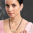 Luxurious Gleaming CZ Mangalsutra Set. Mangalsutra and matching earrings with cubic zirconia stones along with gold plating.