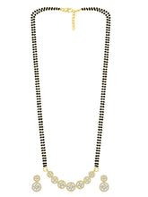 Luxurious Gleaming CZ Mangalsutra Set. Mangalsutra and matching earrings with cubic zirconia stones along with gold plating.