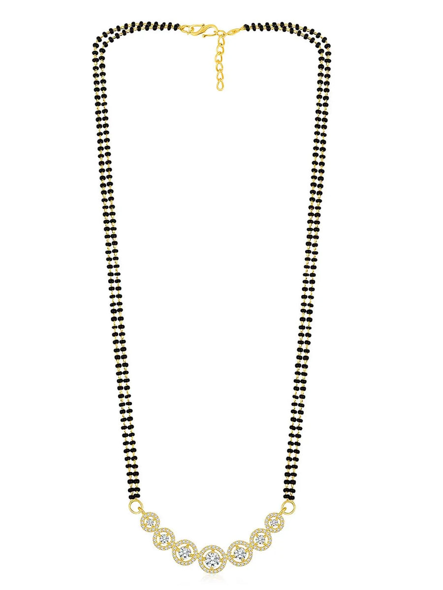 Luxurious Gleaming CZ Mangalsutra Set. Mangalsutra and matching earrings with cubic zirconia stones along with gold plating.