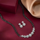 Luxurious Gleaming CZ Mangalsutra Set. Mangalsutra and matching earrings with cubic zirconia stones along with silver plating.