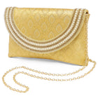 Gold clutch bag named Twilight Gleam Foldover Clutch, featuring pearl detailing and soft fabric texture | Peora
