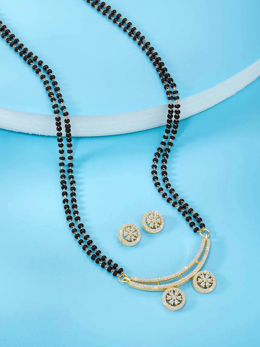 Stunning Dazzling CZ Mangalsutra Set. A set of CZ Mangalsutra jewellery and earrings, with gold-colour plating and black beads.