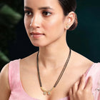 Stunning Dazzling CZ Mangalsutra Set. A set of CZ Mangalsutra jewellery and earrings, with gold-colour plating and black beads.