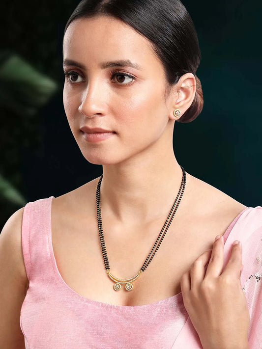 Stunning Dazzling CZ Mangalsutra Set. A set of CZ Mangalsutra jewellery and earrings, with gold-colour plating and black beads.