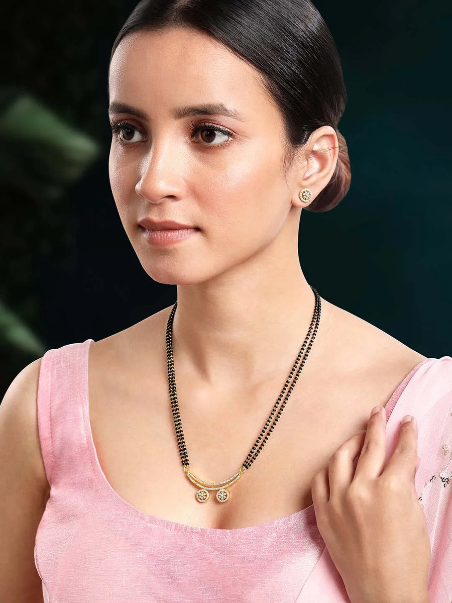 Stunning Dazzling CZ Mangalsutra Set. A set of CZ Mangalsutra jewellery and earrings, with gold-colour plating and black beads.