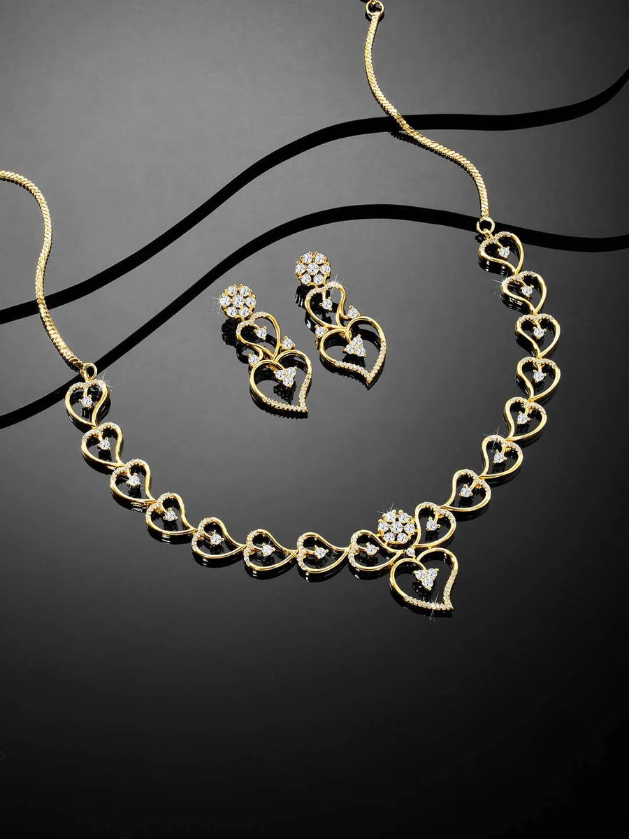 Golden Glamour Dangler CZ Necklace Set. Gold-plated necklace and earrings set with heart shapes and cubic zirconia stones.