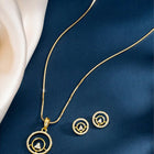 Elegant CZ Round Pendant Orbit Set. Gold-plated pendant necklace and a pair of earrings with a round pendant & CZ stones.