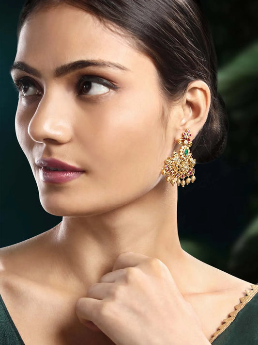 Stunning  Golden Harmony Dangle Earrings. Gold-plated dangle earrings with green and pink stones, Kundan detailing, and hanging beads – traditional festive jewellery.