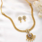 Luxurious Golden Glamour Necklace Set. Necklace set with floral patterns and pink, green & white stones.