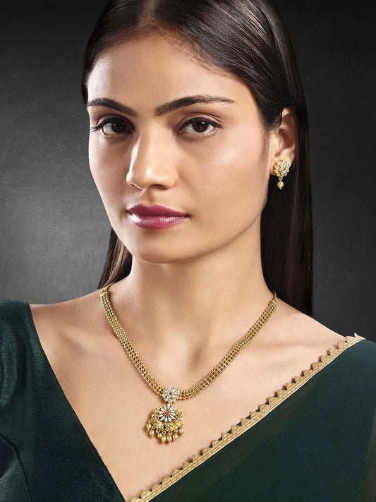 Luxurious Golden Glamour Necklace Set. Necklace set with floral patterns and pink, green & white stones.