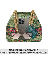 Green potli bag named Floral Threadwork Potli with Bead Handle, featuring artificial beads detailing and soft fabric texture | Peora
