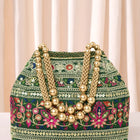 Green potli bag named Floral Threadwork Potli with Bead Handle, featuring artificial beads detailing and soft fabric texture | Peora
