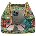 Green potli bag named Floral Threadwork Potli with Bead Handle, featuring artificial beads detailing and soft fabric texture | Peora
