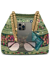 Green potli bag named Floral Threadwork Potli with Bead Handle, featuring artificial beads detailing and soft fabric texture | Peora
