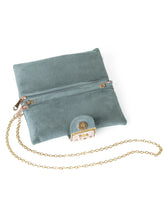 Grey clutch bag named Clutch Bags Crafted for Elegance, featuring pearl detailing and soft fabric texture | Peora
