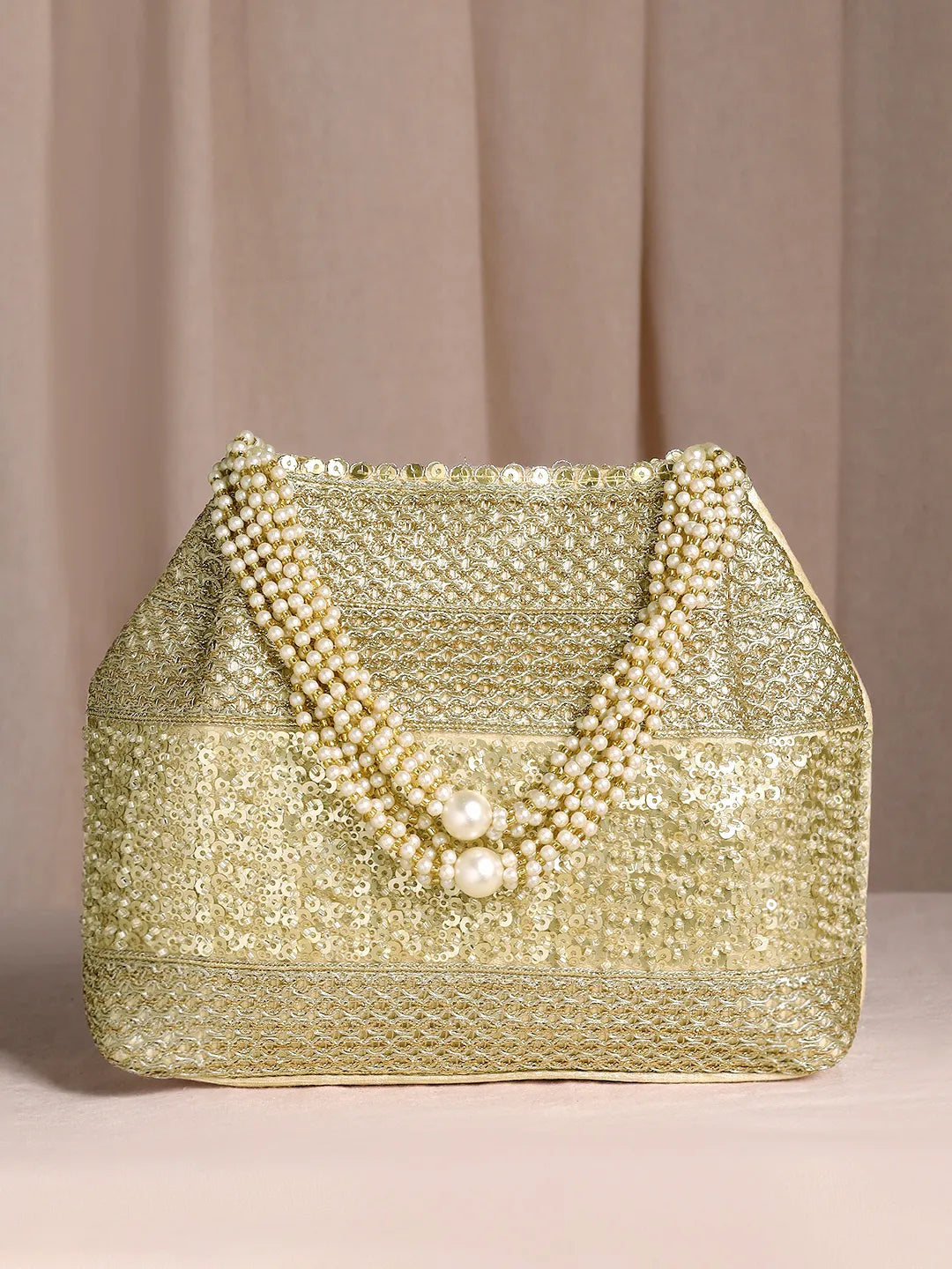 Gold potli bag named Traditional Zari Sequins Potli Bag, featuring artificial beads detailing and soft fabric texture | Peora
