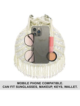 White potli bag named Handcrafted Pearl Potli Styles, featuring pearl detailing and soft fabric texture | Peora
