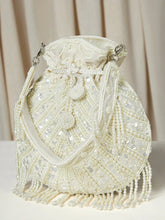 White potli bag named Handcrafted Pearl Potli Styles, featuring pearl detailing and soft fabric texture | Peora
