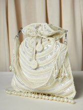 White potli bag named Handcrafted Pearl Potli Styles, featuring pearl detailing and soft fabric texture | Peora
