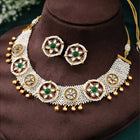 Glowing Gleaming Pearls Choker Set Gold choker necklace set with pearls, green stones, red meenakari work, and Kundan embellishments – best selling jewellery from Peora