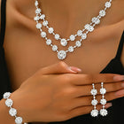 White necklace earrings bracelet set crafted from alloy, adorned with crystals & cubic zirconia for an elegant, timeless look | Peora
