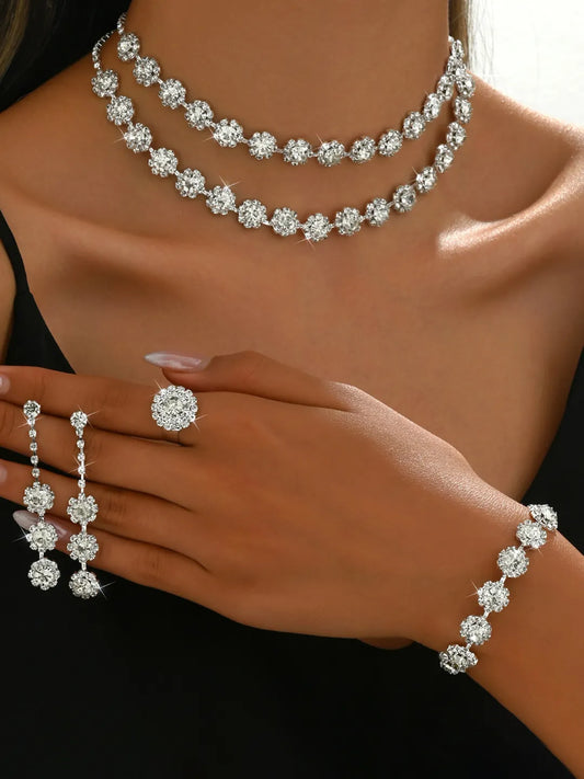 White necklace earrings bracelet ring set crafted from alloy, adorned with crystals & cubic zirconia for an elegant, timeless look | Peora
