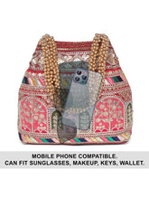 Maroon potli bag named Ethnic Embroidered Potli Purse, featuring artificial beads detailing and soft fabric texture | Peora

