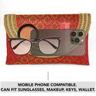 Maroon clutch bag named Twilight Gleam Foldover Clutch, featuring pearl detailing and soft fabric texture | Peora
