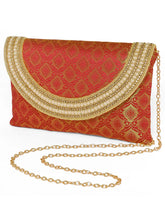 Maroon clutch bag named Twilight Gleam Foldover Clutch, featuring pearl detailing and soft fabric texture | Peora
