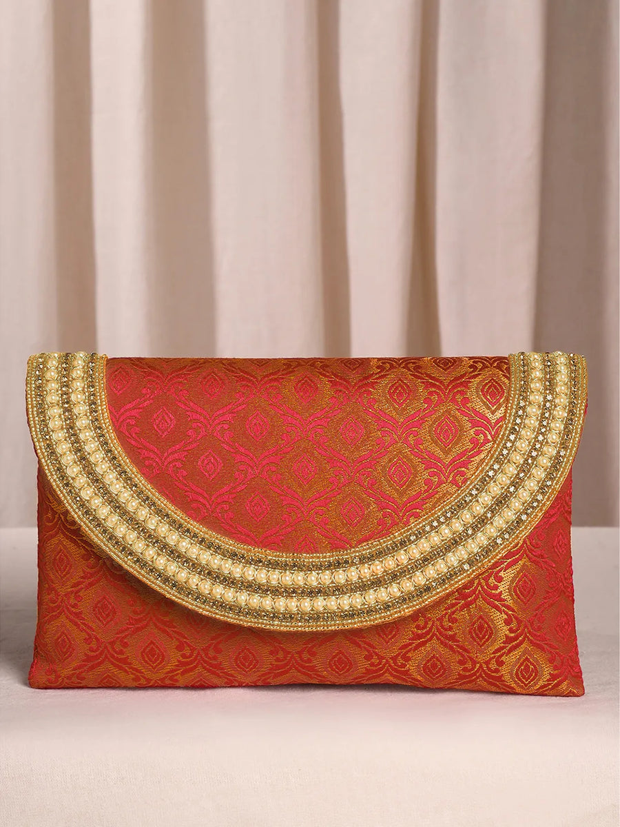 Maroon clutch bag named Twilight Gleam Foldover Clutch, featuring pearl detailing and soft fabric texture | Peora
