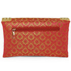 Maroon clutch bag named Twilight Gleam Foldover Clutch, featuring pearl detailing and soft fabric texture | Peora
