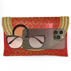 Maroon clutch bag named Twilight Gleam Foldover Clutch, featuring pearl detailing and soft fabric texture | Peora
