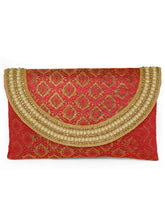 Maroon clutch bag named Twilight Gleam Foldover Clutch, featuring pearl detailing and soft fabric texture | Peora
