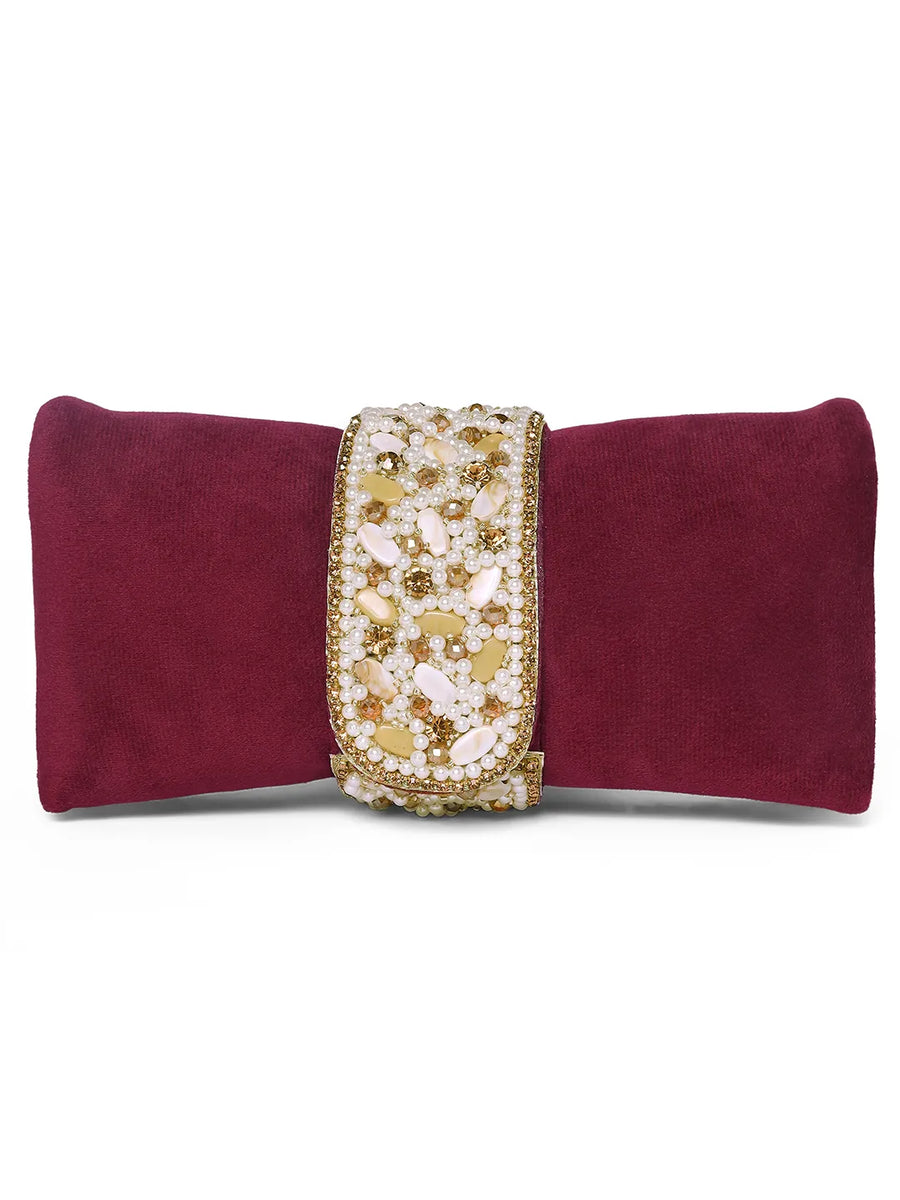 Maroon clutch bag named Clutch Bags Crafted for Elegance, featuring pearl detailing and soft fabric texture | Peora
