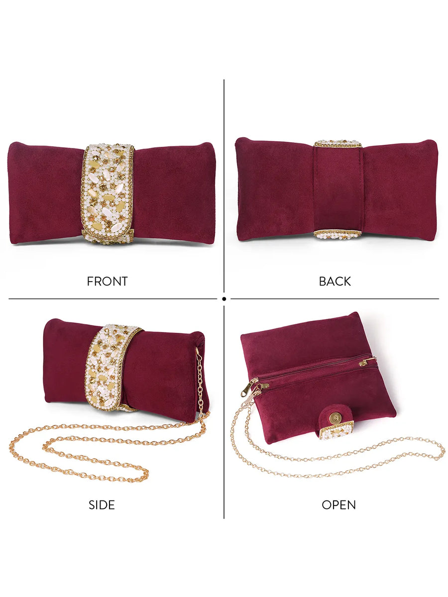 Maroon clutch bag named Clutch Bags Crafted for Elegance, featuring pearl detailing and soft fabric texture | Peora
