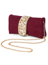 Maroon clutch bag named Clutch Bags Crafted for Elegance, featuring pearl detailing and soft fabric texture | Peora

