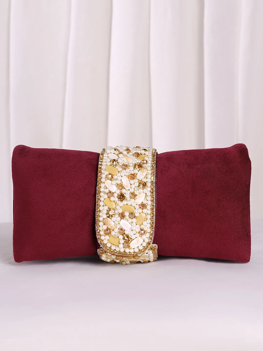 Maroon clutch bag named Clutch Bags Crafted for Elegance, featuring pearl detailing and soft fabric texture | Peora
