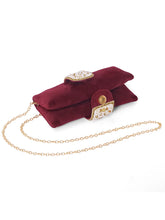 Maroon clutch bag named Clutch Bags Crafted for Elegance, featuring pearl detailing and soft fabric texture | Peora
