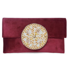 Maroon clutch bag named Velvet Midnight Aura Flap Clutch, featuring artificial beads detailing and soft fabric texture | Peora
