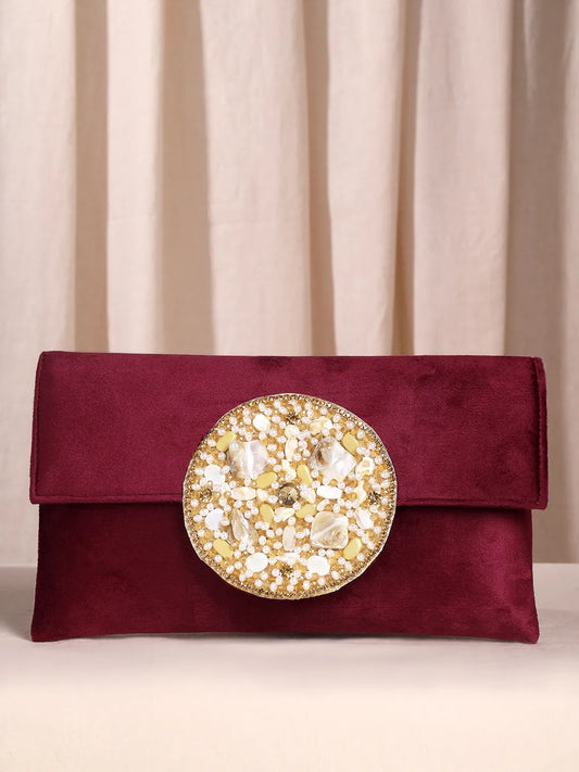 Maroon clutch bag named Velvet Midnight Aura Flap Clutch, featuring artificial beads detailing and soft fabric texture | Peora
