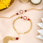 Close-up of Vibrant Meenakari Rakhi-Lumba Pair featuring red & gold thread, beads work, and gold plating – ideal for Raksha Bandhan | Peora
