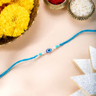 Close-up of Minimalist Evil Eye Silver Thread featuring sky blue thread, beads work, and rhodium plating – ideal for Raksha Bandhan | Peora
