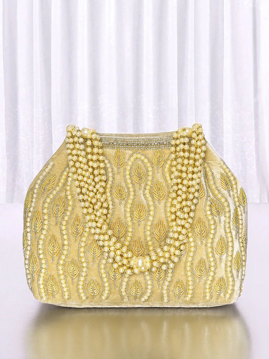 Gold potli bag named Embroidered Beaded Potli Purse, featuring faux pearl detailing and soft fabric texture | Peora
